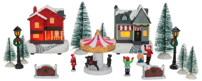 Julby-set med två hus, karusell, granar, lyktstolpar och figurer. Snödetaljer och festliga dekorationer. Perfekt för juldekoration eller utställning.