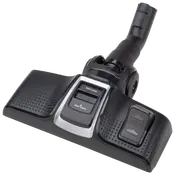 Sort støvsugermundstykke med justerbare indstillinger til dybderens og let rengøring, teksturerede sider for greb og rørforbindelse til støvsugerslange.