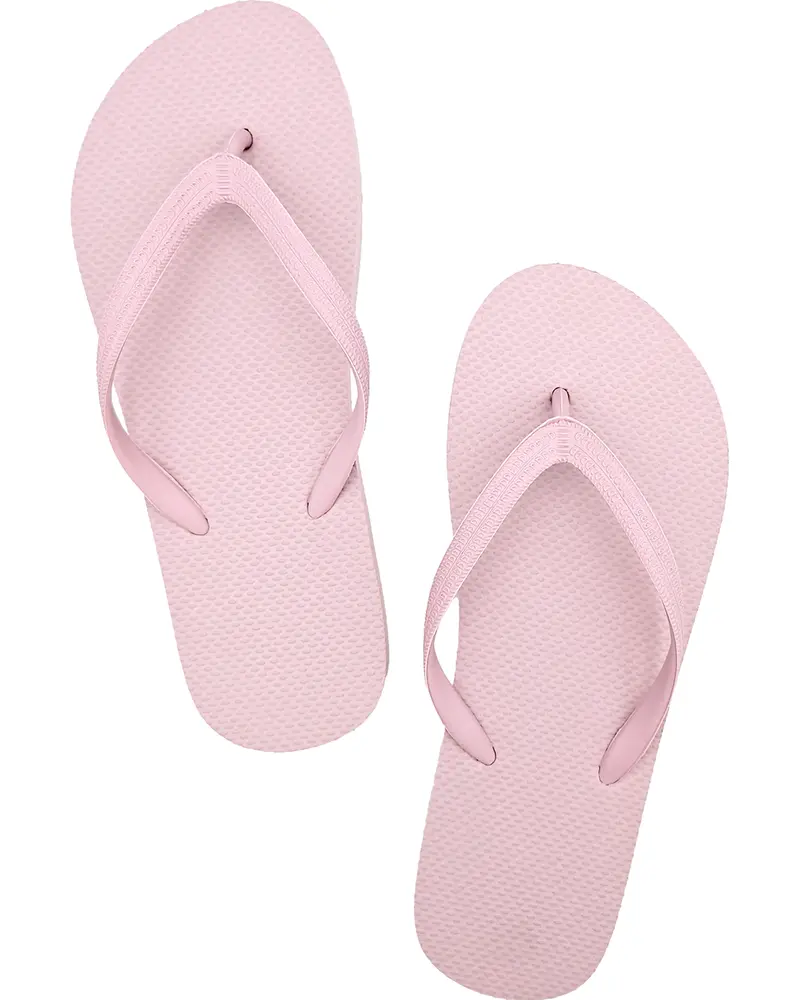 Lyserøde klipklappere med teksturerede gummisåler og matchende lyserøde remme. Enkel, afslappet stil, lette og nemme at tage på. Velegnet til strand eller hverdagsbrug.