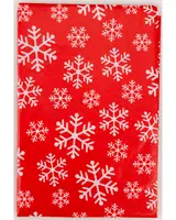 Rött presentpapper med ett festligt mönster av vita snöflingor i olika storlekar. Perfekt för julklappar. Slät, glansig yta förhöjer det färgstarka motivet.