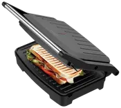 Elektrisk paninigrill med non-stick grillplader, sort ydre og rustfrit stålhåndtag. Flydende hængsel. Viser sandwich med grøntsager og ost. Kompakt design til hjemmebrug.
