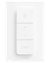 Hvid Philips Hue smart lyskontakt med fire knapper: tænd/sluk, lysstyrke op, lysstyrke ned og Hue-logo. Minimalistisk design, vægmonteret til smart belysning.
