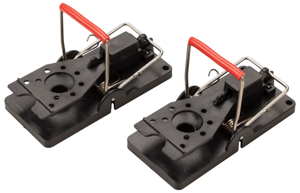 Two black rectangular devices with a spring-loaded metal bar and a red plastic grip. Each has a circular hole in the center and multiple smaller holes around it, designed for easy bait placement. The base is sturdy plastic, and the metal bar is attached to a mechanism for quick activation. The overall design is compact and easy to set up.