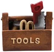 Brun værktøjskasse med "TOOLS" på fronten, indeholder små værktøjer som en sav med rød håndtag og andre genstande. Fremstillet af malet materiale, dekorativ eller sjov brug.