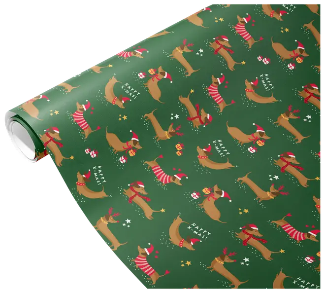 Green wrapping paper featuring a repeating pattern of dachshund dogs wearing red and white Christmas accessories such as Santa hats, scarves, and sweaters. Some dogs are holding gifts or have reindeer antlers. The design includes small stars, snowflakes, and the phrase 'Happy Xmas' scattered throughout.