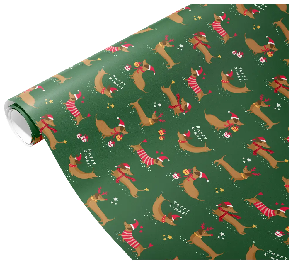 Green wrapping paper featuring a repeating pattern of dachshund dogs wearing red and white Christmas accessories such as Santa hats, scarves, and sweaters. Some dogs are holding gifts or have reindeer antlers. The design includes small stars, snowflakes, and the phrase 'Happy Xmas' scattered throughout.