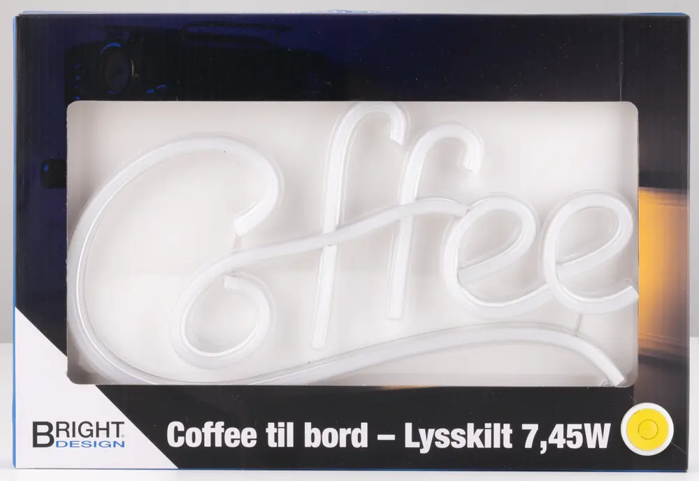 White LED neon sign shaped in cursive script spelling the word 'Coffee', designed for tabletop display. The sign has a smooth, continuous tube construction and is powered by 7.45 watts. It comes packaged in a rectangular box with a clear window on the front, allowing the product to be seen inside.
