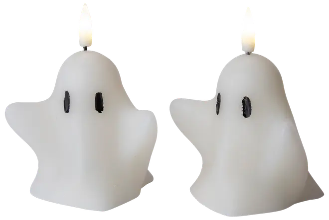 Två vita ljus formade som tecknade spöken med svarta ovala ögon. Varje ljus har en veke upptill, perfekt för Halloween eller dekoration.