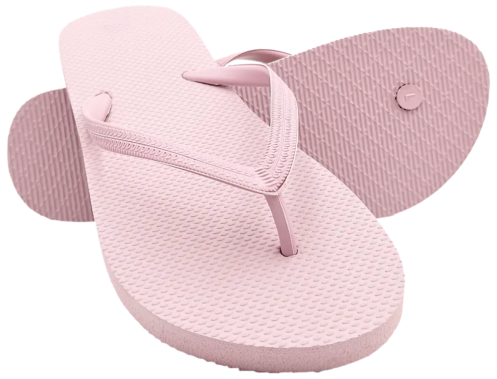 Lyserøde gummiflipflops med teksturerede såler og mønstrede remme. Klassisk, enkel stil til afslappet brug, strand eller pool. Holdbare, lette og nemme at rengøre.
