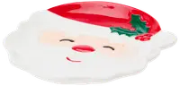Keramiktallrik formad som jultomtens ansikte med röd luva, järnek, vitt skägg och leende uttryck. Festlig design, perfekt för julgodis eller dekoration.