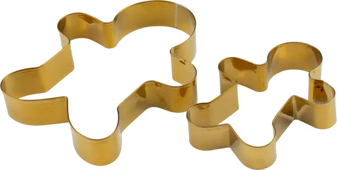 Sæt med to kageudstikkere i guldmetal formet som honningkagemænd, én stor og én lille. Glatte kanter, perfekte til bagning af småkager eller kreative projekter.
