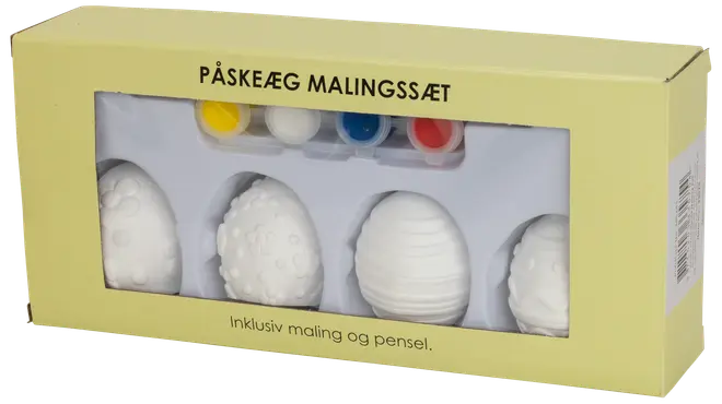 Påskägg målningsset med fyra vita keramikägg med olika mönster, fyra små färgburkar i gult, vitt, blått och rött samt en pensel.