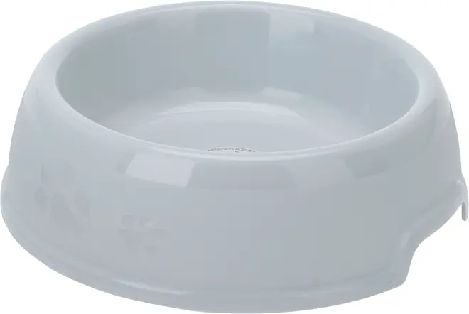 Vit plastskål för husdjur med präglade tassavtryck på sidan. Rund form, slät insida, något upphöjd kant, passar för mat eller vatten. Hållbar och lätt att rengöra.