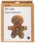 DIY-set för att göra en pepparkaksgubbe-kudde. Brun plysch, röd fluga, vita knappar, leende ansikte. Färdig storlek: 29 x 36 cm. Från 6 år.
