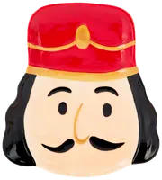 Keramiktallrik formad som en nötknäckares ansikte med röd hatt, svart hår, mustasch och enkla målade ansiktsdrag. Perfekt för festdukning.