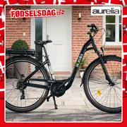 Elcykel fra Aurelia foran murstenshus