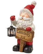 Julemandfigur med lanterne og træskilt med teksten 'Glædelig jul', rød hat, hvidt skæg og sorte støvler som festlig juledekoration.