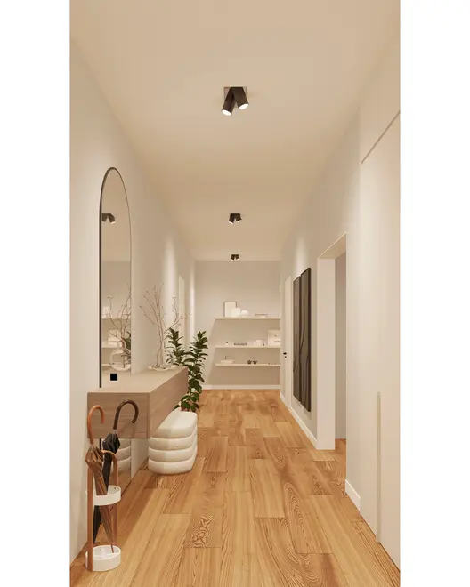 Moderne gang med lyst trægulv, hvide vægge, loftsspots, stor vægspejl, svævende konsol, paraplyholder, puf, stueplante og minimalistiske dekorationer.