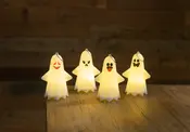 Fyra lysande LED-nattlampor formade som spöken med olika ansiktsuttryck, tillverkade av vit plast, perfekta för Halloween eller barnrum, placerade på en träyta.