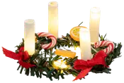 Mini julekrans med fire hvide lys, kunstigt grønt, røde sløjfer, slikstokke, appelsinskiver og små lys. Festlig dekoration til bord eller julepynt.