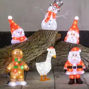 Sæt med oplyste juledekorationer: julemand, snemænd, honningkagemand, gås og festlige figurer i akryl med LED-lys, velegnet til indendørs eller udendørs brug.