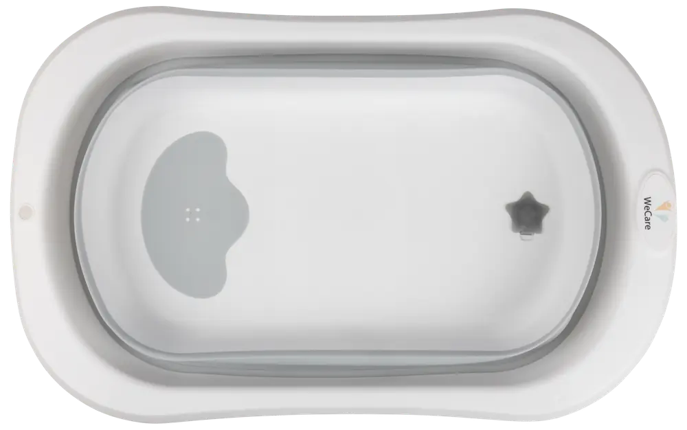 Vit babybadbalja med ergonomisk design, halkskydd och stjärnformad propp. Passar spädbarn, ger säker och bekväm badupplevelse. Lätt och enkel att rengöra.