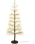 Kunstigt træ med brun stamme og grene, dekoreret med mange varme hvide LED-lys. Står på en rund sort fod og har synlig ledning. Moderne festlig dekoration.