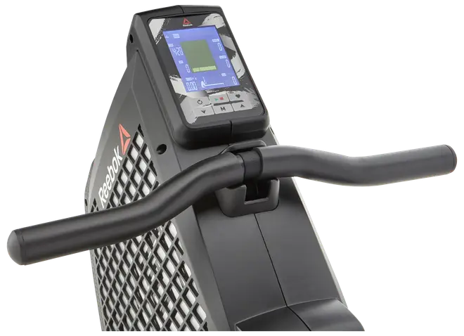 Reebok motionscykel med digitalt display, kontrolknapper og ergonomiske håndtag. Displayet viser træningsdata, og stellet har ventileret design for holdbarhed og komfort.
