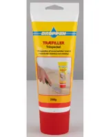 A 250g tube with a yellow and white label and a red cap. The label features blue and red text, and an image showing a hand using a putty knife to apply the product to a wooden surface. The packaging indicates it is suitable for repairing cracks in wood, for both indoor and outdoor use.