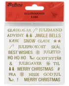Ark med guldfarvede juleklistermærker med danske og engelske ord som "Glædelig Jul," "Julemand," og ikoner som stjerner, træer og kane. Indeholder seks ark.
