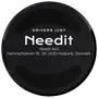 Rund sort skive med hævet kant og Needit-branding, hvid tekst og svage CE-symboler.