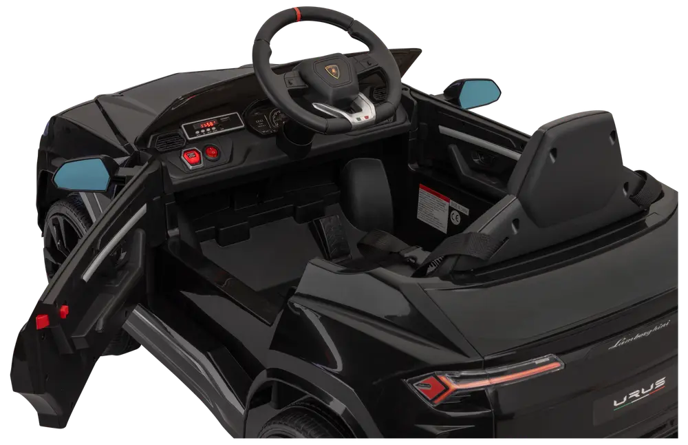 Svart Lamborghini Urus elbil för barn med realistisk instrumentbräda, ratt, öppningsbara dörrar, säte och detaljerade bakljus. Designad för barn, efterliknar lyxig SUV.