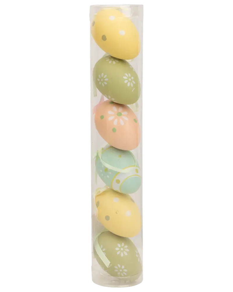 Sæt med seks dekorative æg i pastelfarver i et klart rør, med blomster- og prikkemønstre. Perfekt til påske- eller forårsdekoration. Lavet af let materiale.