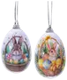 Två äggformade prydnader med målade kaniner i korgar, omgivna av färgglada påskägg och vårblommor, båda med silverfärgad upphängningsögla.