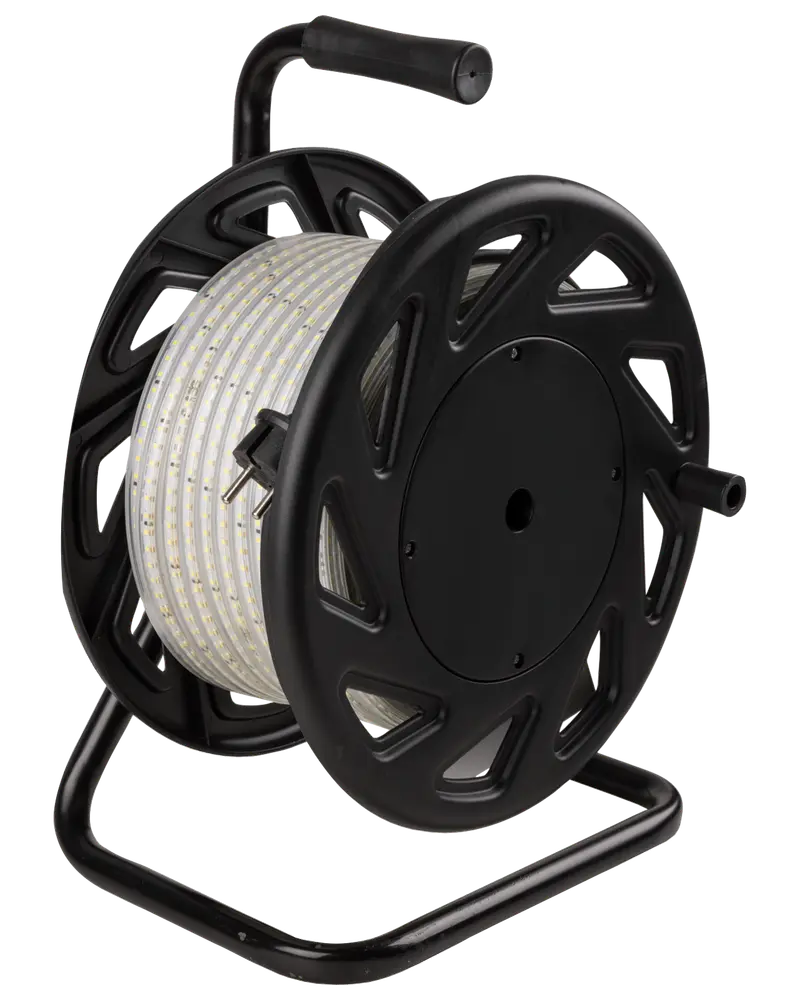 A long, flexible LED strip light coiled neatly around a large, black plastic reel with a sturdy metal frame. The reel features a handle on top for easy carrying and a side crank for winding or unwinding the strip. The LED strip is encased in a clear protective covering, making it suitable for various indoor or outdoor uses.