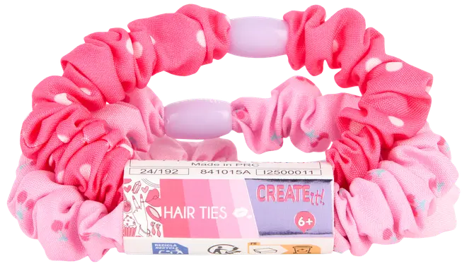 Sæt med to stof-scrunchies i lyserøde nuancer med hvide prikker, egnet til børn fra 6 år. Blødt, elastisk materiale for behagelig hårstyling.