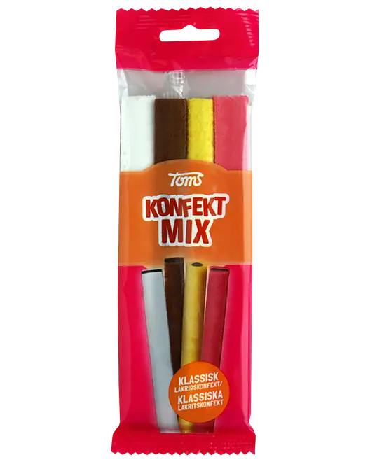 Tom's Konfekt Mix klassisk lakridskonfekt i klar pink og orange pose med fire farvede, stangformede stykker.