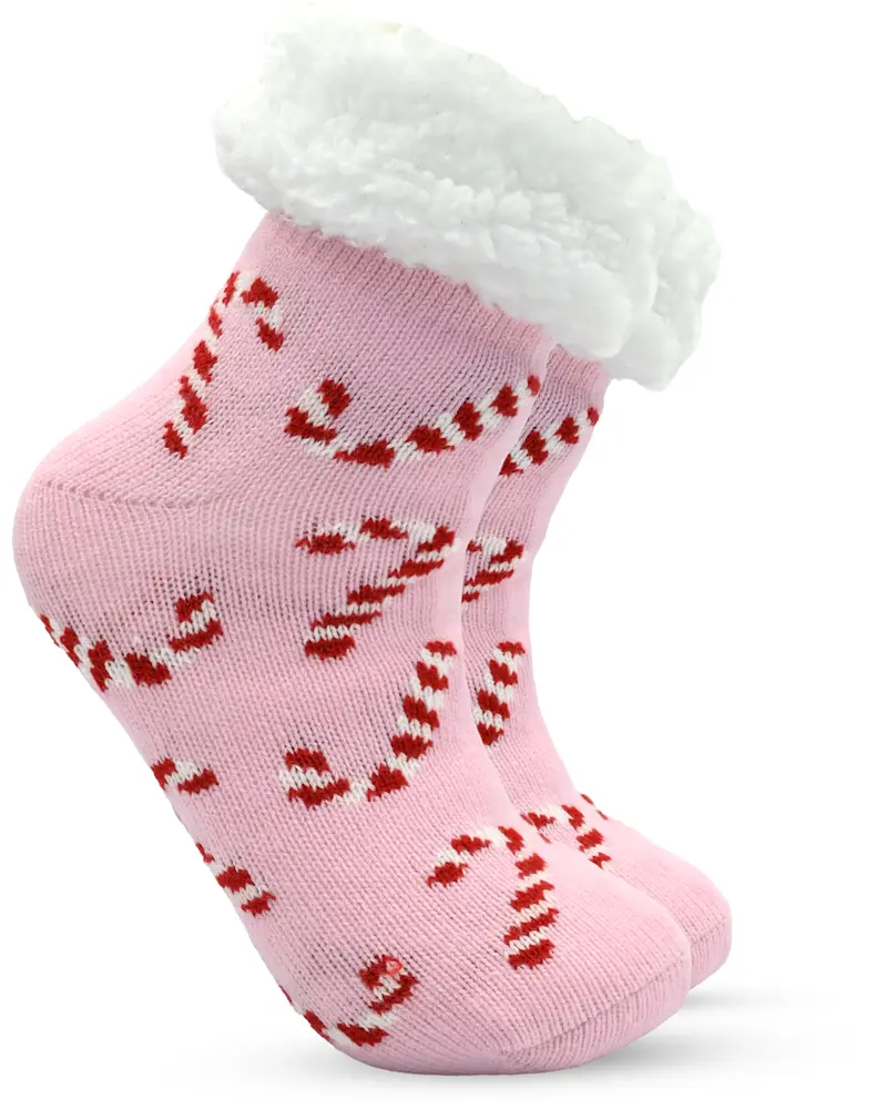 Rosa fluffiga strumpor med vitt sherpa-foder och rödvita polkagrisar, ankelhöga, varma och bekväma, perfekta för vinter eller mysiga stunder.