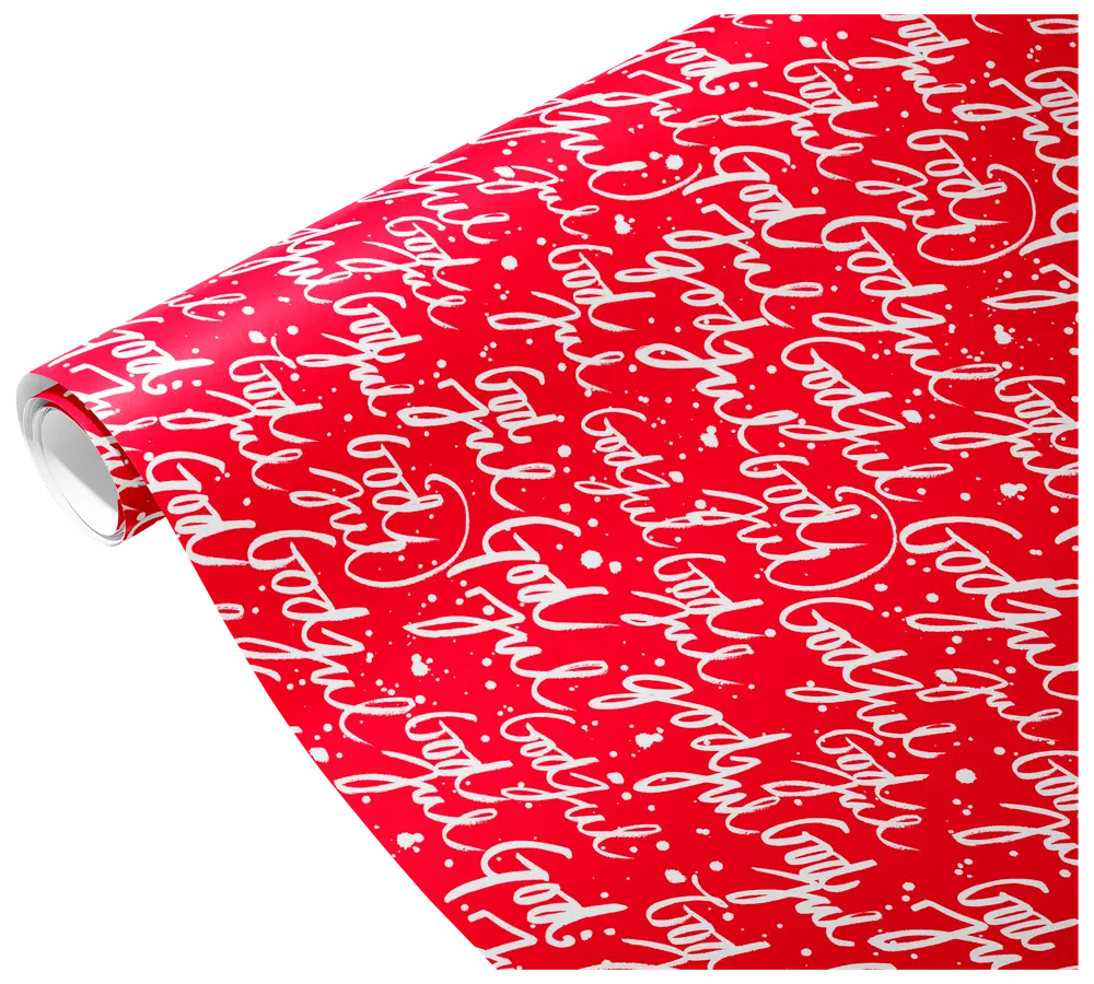 Rød gavepapirrulle med hvid skrift "God jul" gentaget og hvide stænk. Festlig og velegnet til julegaveindpakning. Blank overflade, standard rullestørrelse.