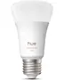 Smart LED-pære med E27-fatning, hvid og farve, mærket "hue white and color 1100". Moderne design, velegnet til tilpasset belysning i hjemmet.