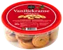Runde vaniljekranse i en klar plastbøtte med rødt låg. Etiketten viser mærket Nordthy, produktnavn Vaniljekranse og nettovægt 225g.