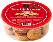 Runde vaniljekranse i en klar plastbøtte med rødt låg. Etiketten viser mærket Nordthy, produktnavn Vaniljekranse og nettovægt 225g.