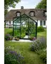 Kompakt drivhus i glas med mørk metalramme og saddeltag. Perfekt til små haver, dyrkning af grøntsager og blomster. Med hylder og god lysgennemstrømning.