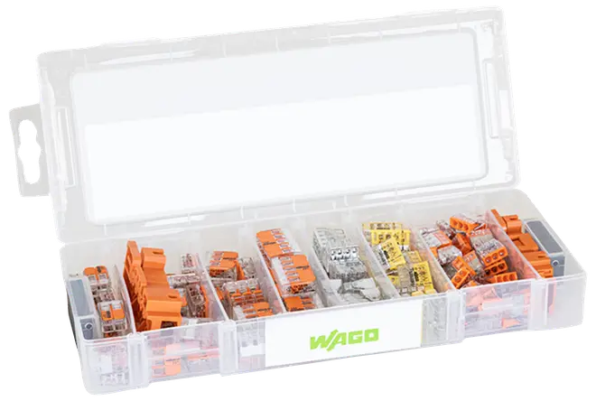 Gennemsigtig plastopbevaringsboks med flere rum fyldt med assorterede WAGO elektriske samlemuffer i orange, grå og gul.
