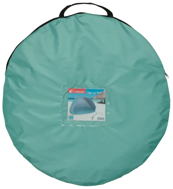 Ljusblå rund bärväska med handtag, innehåller ett pop-up strandtält. Väskan har en etikett som visar tältet uppsatt på stranden.
