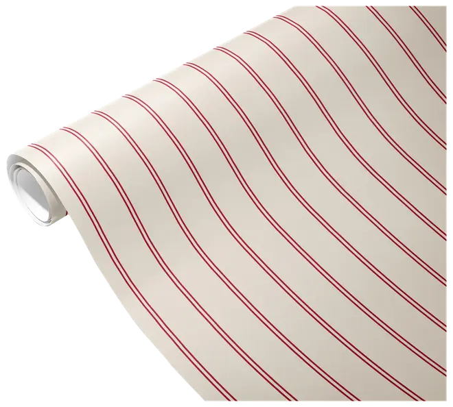 Krämfärgad rulle av randigt papper eller tapet med tunna diagonala röda dubbelränder, delvis utrullad.