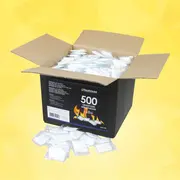 Åben sort papkasse med Heatmax 500 optændingsposer, hvide individuelle pakker, der ligger i og foran kassen, med produktlabel på forsiden.