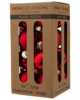 Förpackning med 16 silverfärgade julgranskulor i glas, varje 3,5 cm i diameter, i brun kartong med fönster för enkel visning och förvaring.