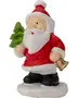 Keramisk julemandsfigur med rød dragt, hvidt skæg, sorte støvler, holder et grønt juletræ og en guldbjælde, står på hvid base. Festlig juledekoration.