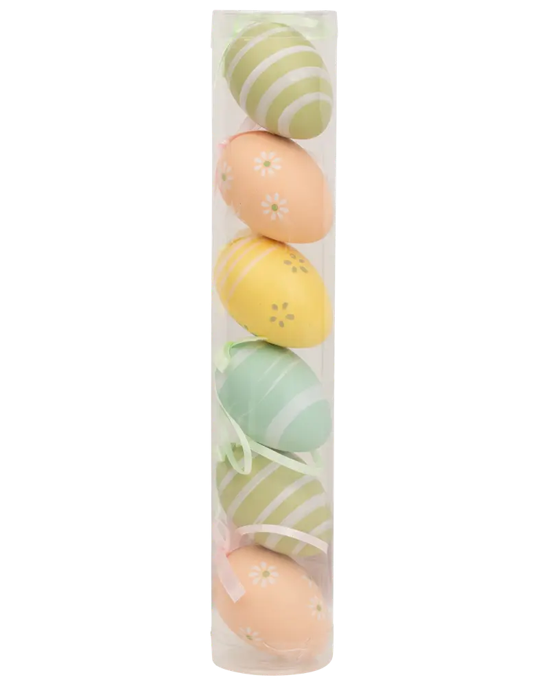 Sæt med seks dekorative påskeæg i pastelfarver med striber og blomster, pakket i et klart plastikrør. Hvert æg har et bånd til ophængning.